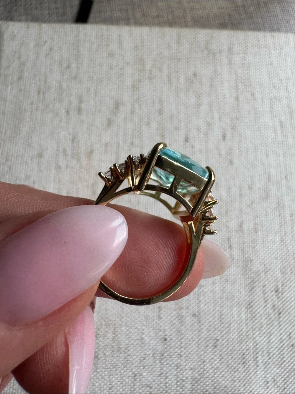 Stunning gold tone ring with blue crystal